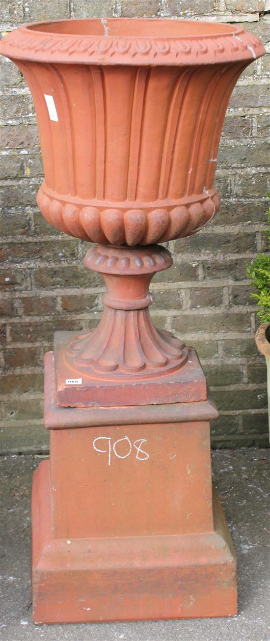 Large terracotta urn on stand